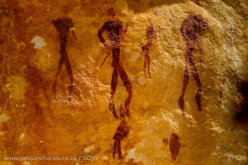 a painting of people walking on a rock at Kagga Kamma Nature Reserve in Lochlynne