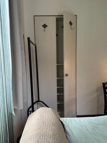 a bedroom with a mirror next to a bed at Villa Art'è in Locarno