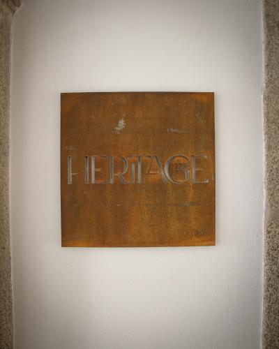 a sign on a wall with the word heritage at MS Collection Arouca - Mosteiro de Arouca in Arouca
