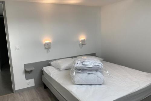 a backpack sitting on a bed in a room at Triplex in Albiez-Montrond - 4 Bedrooms in Albiez-Montrond