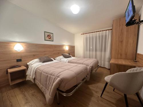 Postel nebo postele na pokoji v ubytování Hotel Zeni