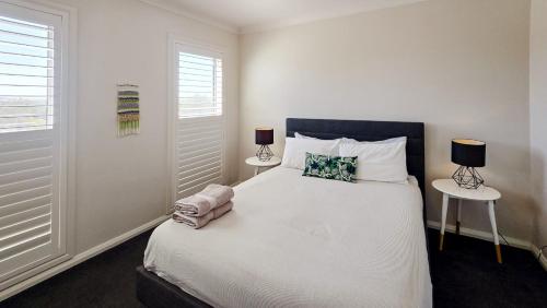 Postel nebo postele na pokoji v ubytování Cypress Hillside Wagga Wagga