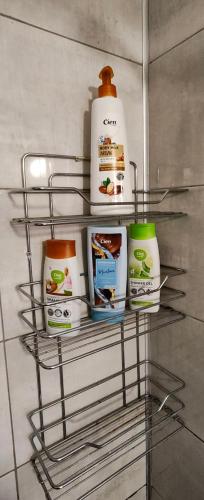 a rack with different types of food items in a refrigerator at Студио Нико - Царево in Tsarevo