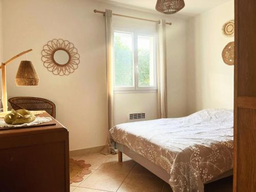 a bedroom with a bed and a window at A Bella Gaia in Cauro