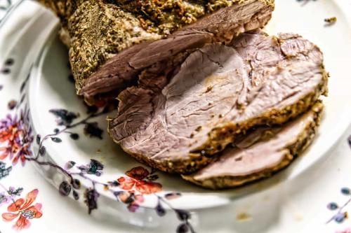 a piece of meat on a plate with bread at Hotel-Restaurant Kostbar in Engen