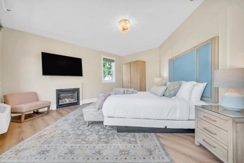 a bedroom with a large bed and a fireplace at Hennessey Estate in Napa