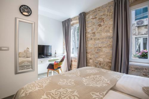 Postel nebo postele na pokoji v ubytování Centro di Centri Rooms