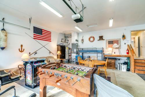 a living room with a foosball table at Pet-Friendly Westport Vacation Rental with Hot Tub! in Westport