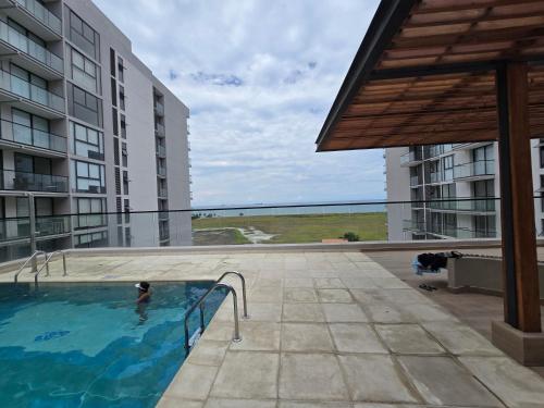 Bazén v ubytování Salinas del Mar Torre 4 Apt 903 nebo v jeho okolí