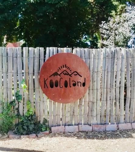 a sign on the side of a wooden fence at KooColand- Container con jacuzzi privado in Tupungato