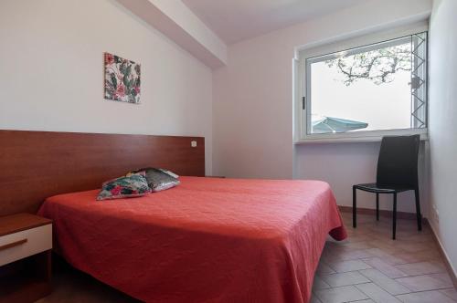 En eller flere senge i et værelse på Villetta Kair 260