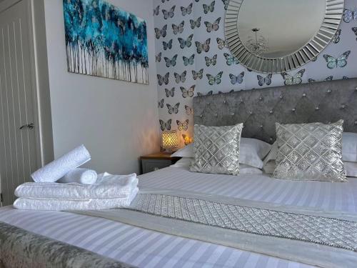 Ένα ή περισσότερα κρεβάτια σε δωμάτιο στο Chic Retreat Apartment Sleeping Two