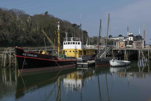 a group of boats docked in a harbor at Domitys Les Gréements d'Or - résidence séniors in Douarnenez