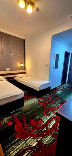 Ένα ή περισσότερα κρεβάτια σε δωμάτιο στο Hostel Orhideea