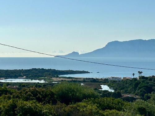 a view of a body of water with mountains at Bellavista Vacation in Olbia