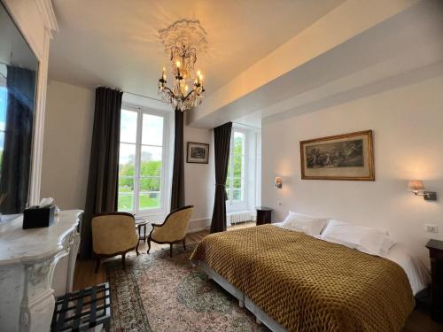Postel nebo postele na pokoji v ubytování Château du Rondon