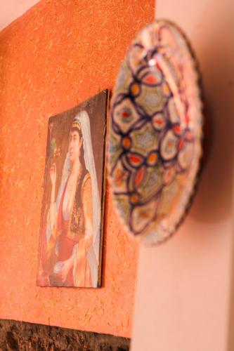 a photo of a picture of a woman on a wall at Auberge Les Montagnes du Paradis Your Hidden Retreat in Paradise Valley in Agadir