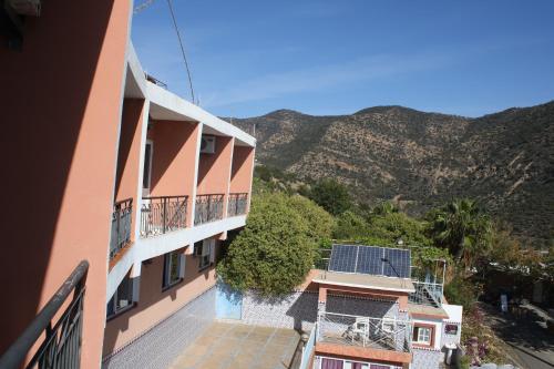 a view of a building with mountains in the background at Auberge Les Montagnes du Paradis Your Hidden Retreat in Paradise Valley in Agadir