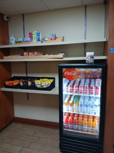 a cocacola soda refrigerator in a store at Best Western Plus Bradenton Hotel & Suites in Bradenton
