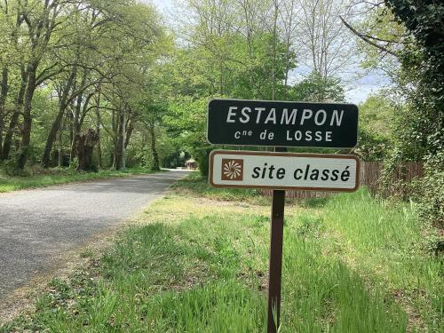 a sign on the side of a road at Cabane de charme in Losse
