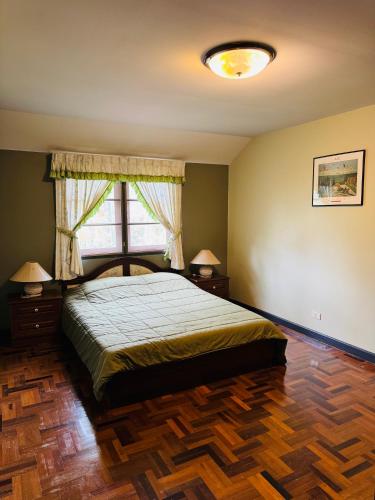 a bedroom with a bed and a window at Oceanside Place Beach Resort in Ban Tha Fat