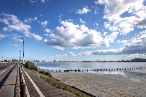 a road next to a body of water at Best Western Hotel Residence Italia in Quartu SantʼElena