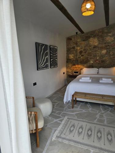 Ένα ή περισσότερα κρεβάτια σε δωμάτιο στο Villa Vivari Suites