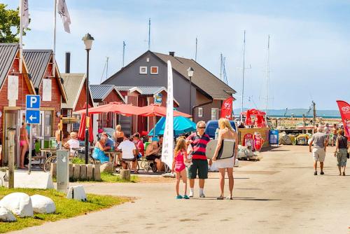 a group of people walking down a street at Mötesplats Borstahusen in Landskrona