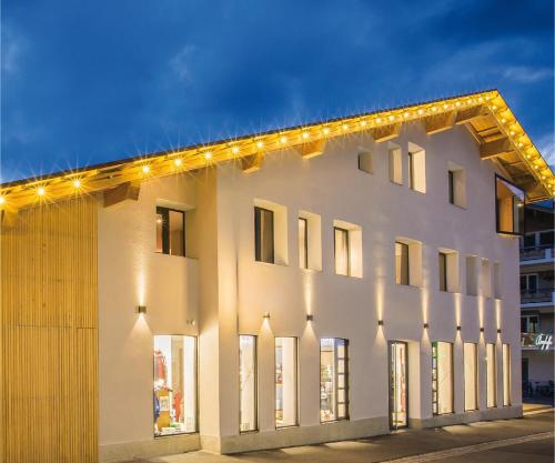 a white building with lights on the side of it at N6 Oberstdorf in Oberstdorf