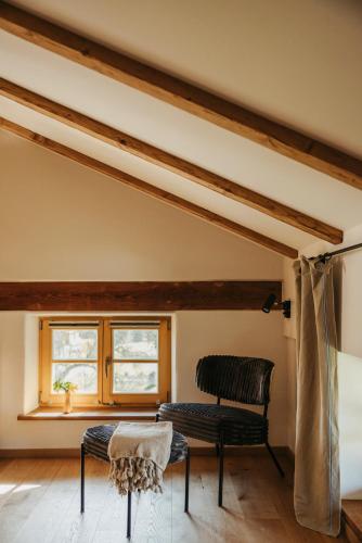 a room with a chair and a window at Staudingerhof in Staudach-Egerndach