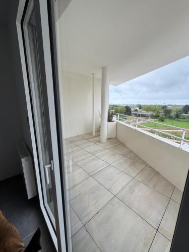 a room with a balcony with a view at Skyline Rooftop Swim Spa in Montpellier