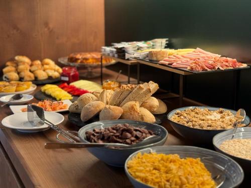 a buffet with many different types of food on a table at Quinta da Amendoeira - Évora - The Farmhouse in Évora