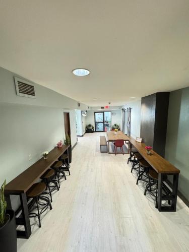 an empty office with long tables and chairs in a room at Valued Stay Aloha in Madison