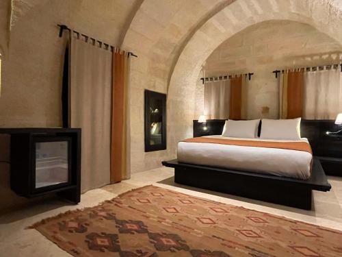 Ένα ή περισσότερα κρεβάτια σε δωμάτιο στο Casa Cappadocia