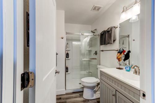 a bathroom with a shower and a toilet and a sink at Happy Palette Home Close to downtown Fenced yard in Sanford