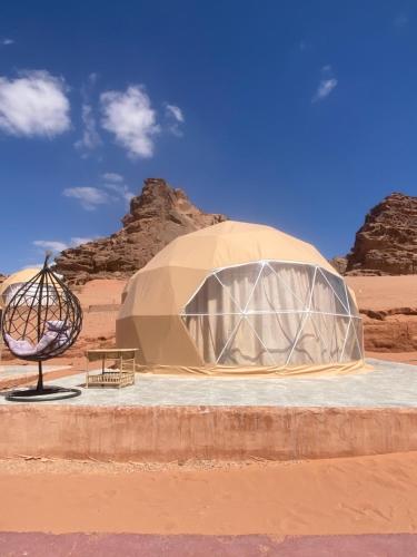 a dome tent in the middle of the desert at Wadi Rum Santa Camp in Wadi Rum