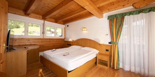 Postel nebo postele na pokoji v ubytování Hotel El Pilon