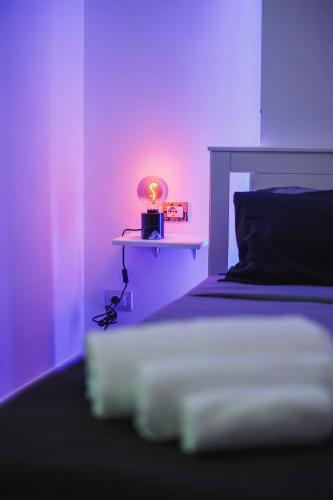 a bedroom with a bed with a light on it at Don Ciccio Apartments&Suite in Conversano