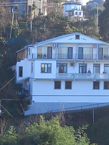a large white house on a hill at Iberia 2019 in Batumi
