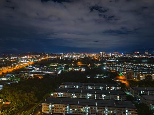 a view of a city at night with lights at K Avenue High Floor Studio Balcony with Sunrise View in Kota Kinabalu