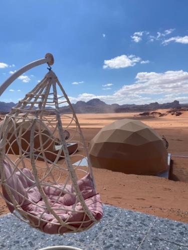 a hanging basket in the middle of the desert at Wadi Rum Santa Camp in Wadi Rum