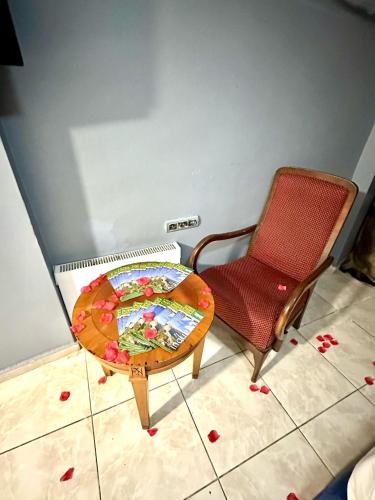 a table and a chair with hearts on the floor at Cendere Old City Hotel in Istanbul