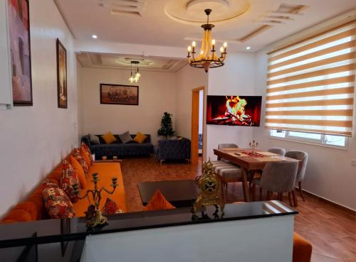 a living room with a couch and a table at Appartement Ghita Essaouira in Essaouira