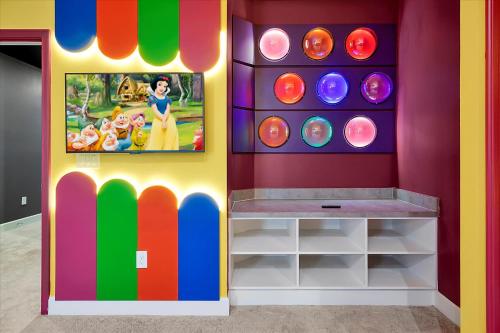 a childs play room with a colorful wall at Epic Orlando Mansion-Pool-Game Room-Theater-2 in Orlando