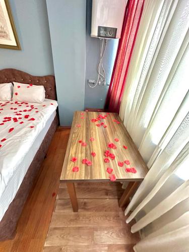 a room with a wooden table with flowers on it at Cendere Old City Hotel in Istanbul