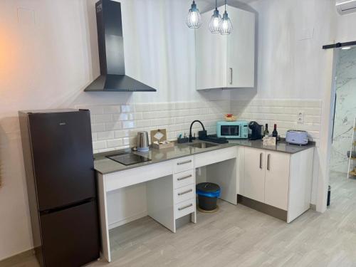 Η κουζίνα ή μικρή κουζίνα στο Apartamentos Turísticos A.Parra