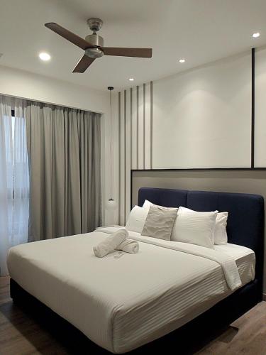 Katil atau katil-katil dalam bilik di Agile Orchid service residence TRX by KL