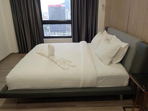Katil atau katil-katil dalam bilik di Agile Orchid service residence TRX by KL