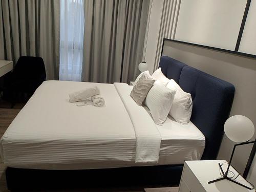 Katil atau katil-katil dalam bilik di Agile Orchid service residence TRX by KL