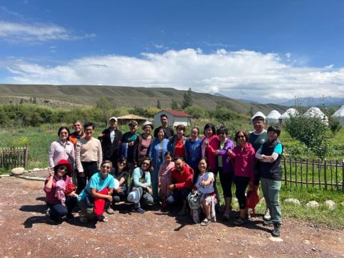 a group of people posing for a picture at Eco Village Lodge in Dzhetyoguz